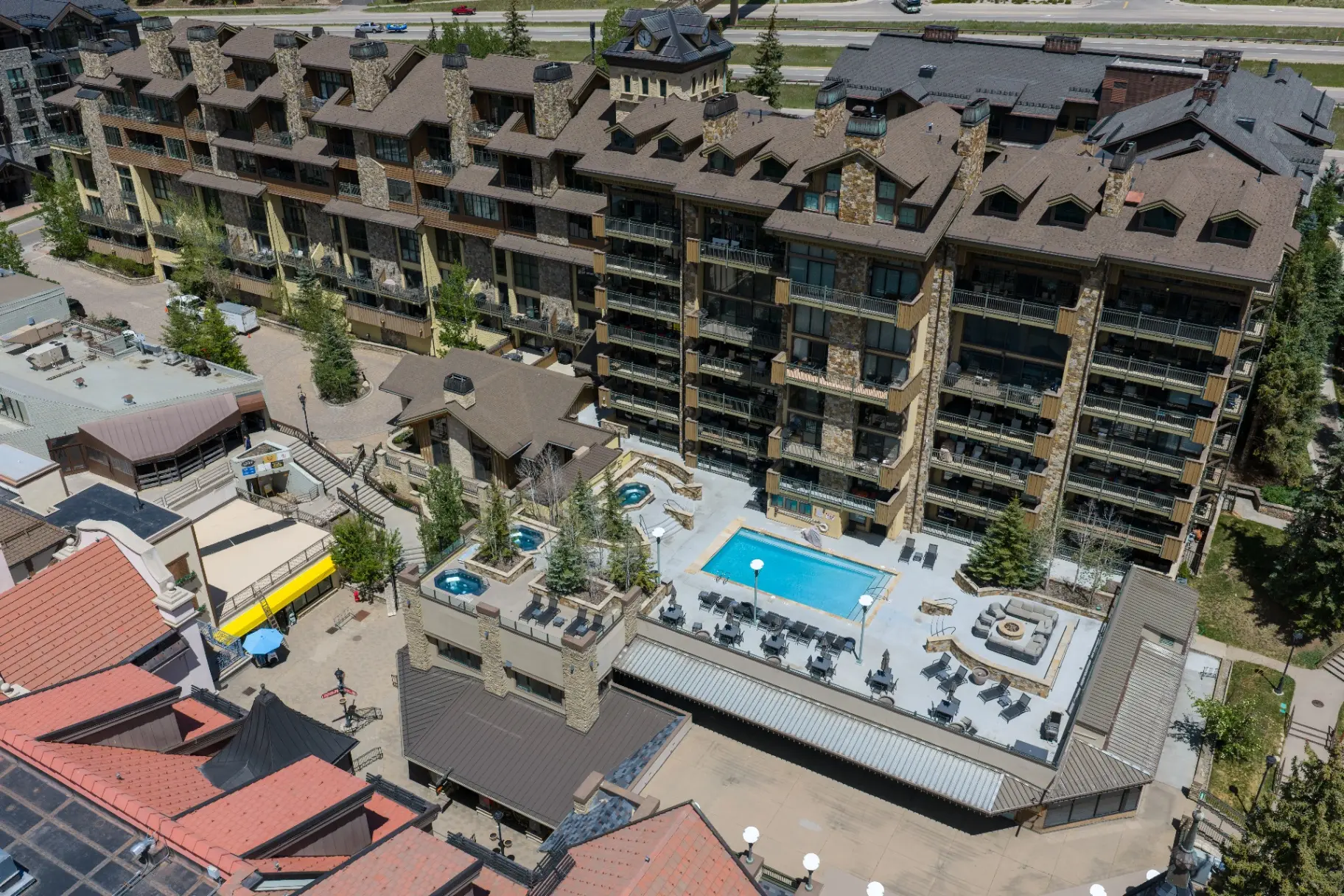 Pool, hot tubs, and fire pit lounge from above