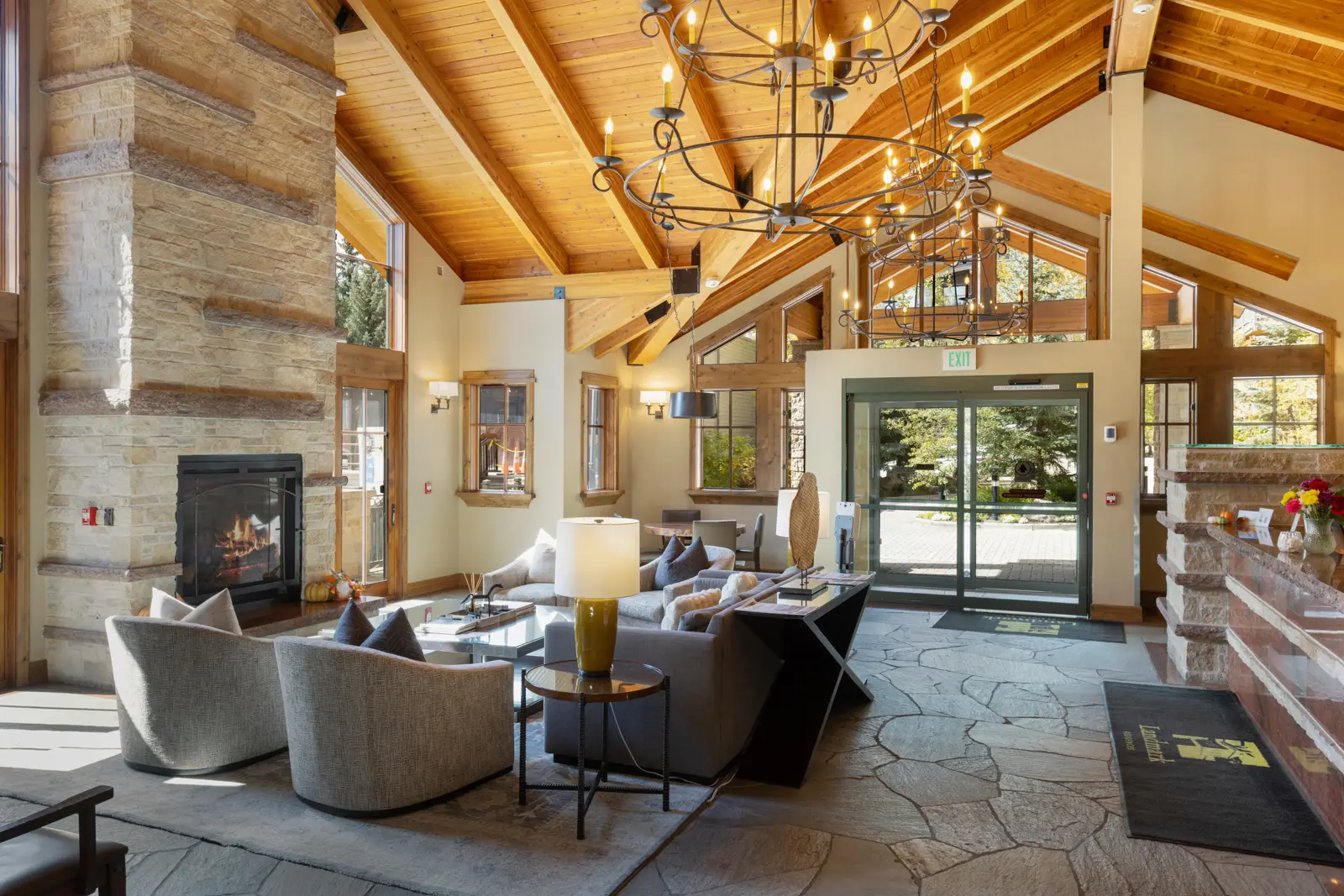 Lobby with stone fireplace and timbered ceiling