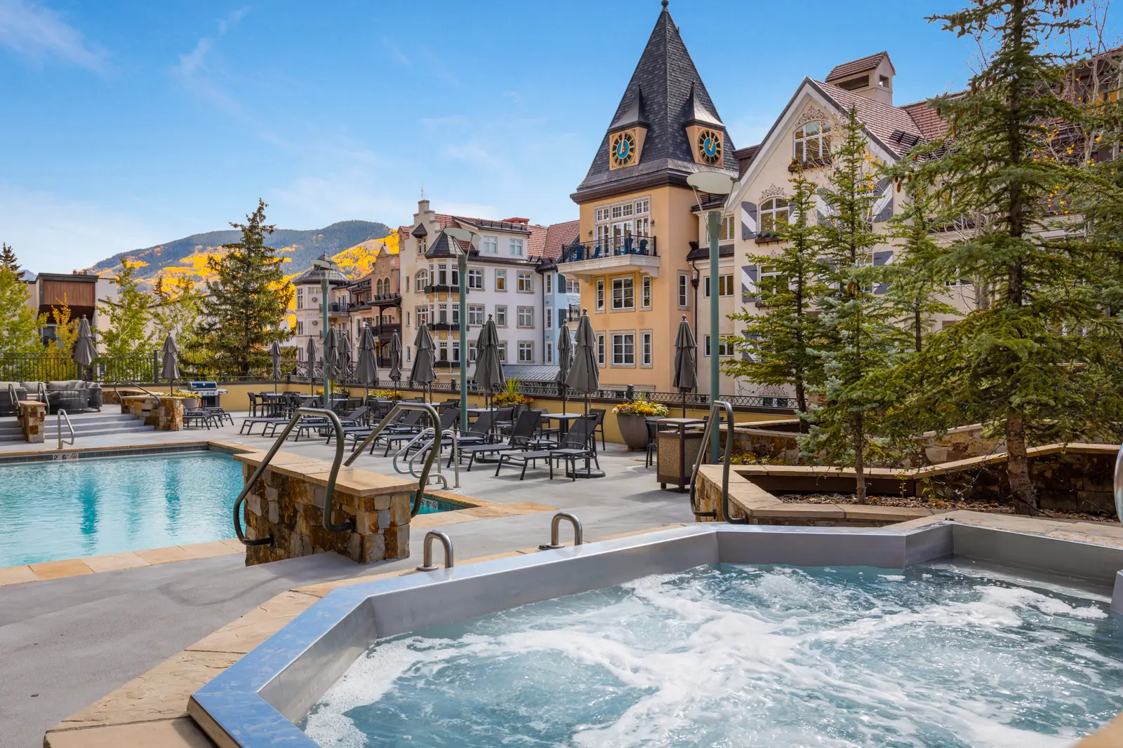 Pool and hot tubs with village views