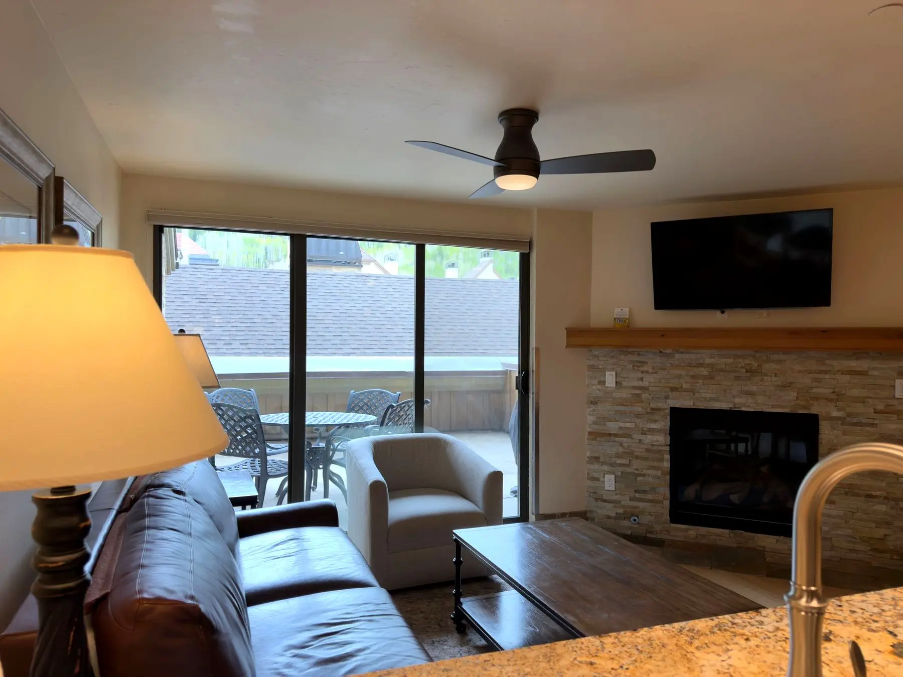 Living room with fireplace and terrace doors