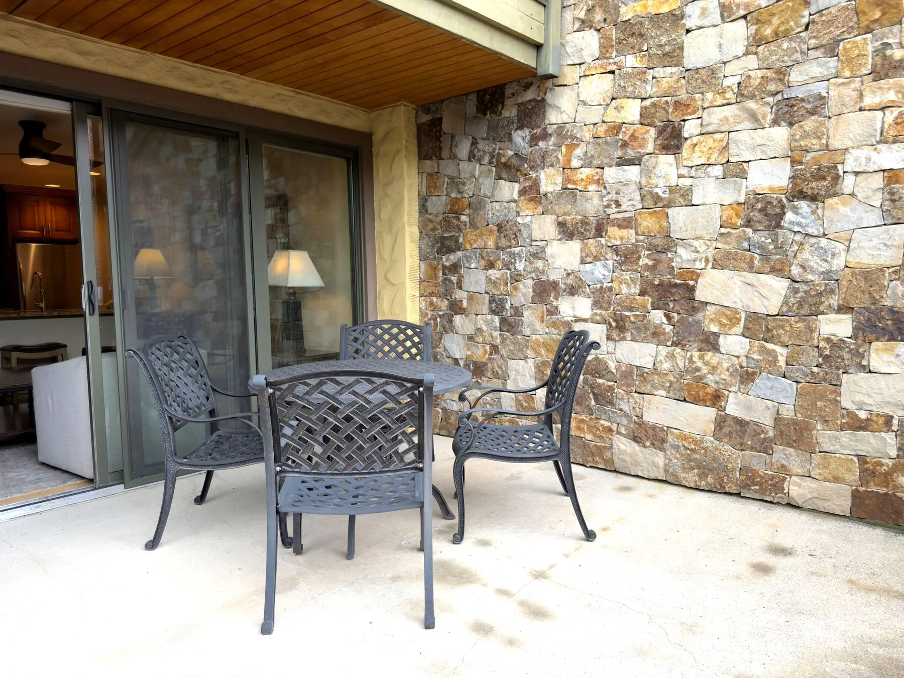 Private patio with stone accent wall