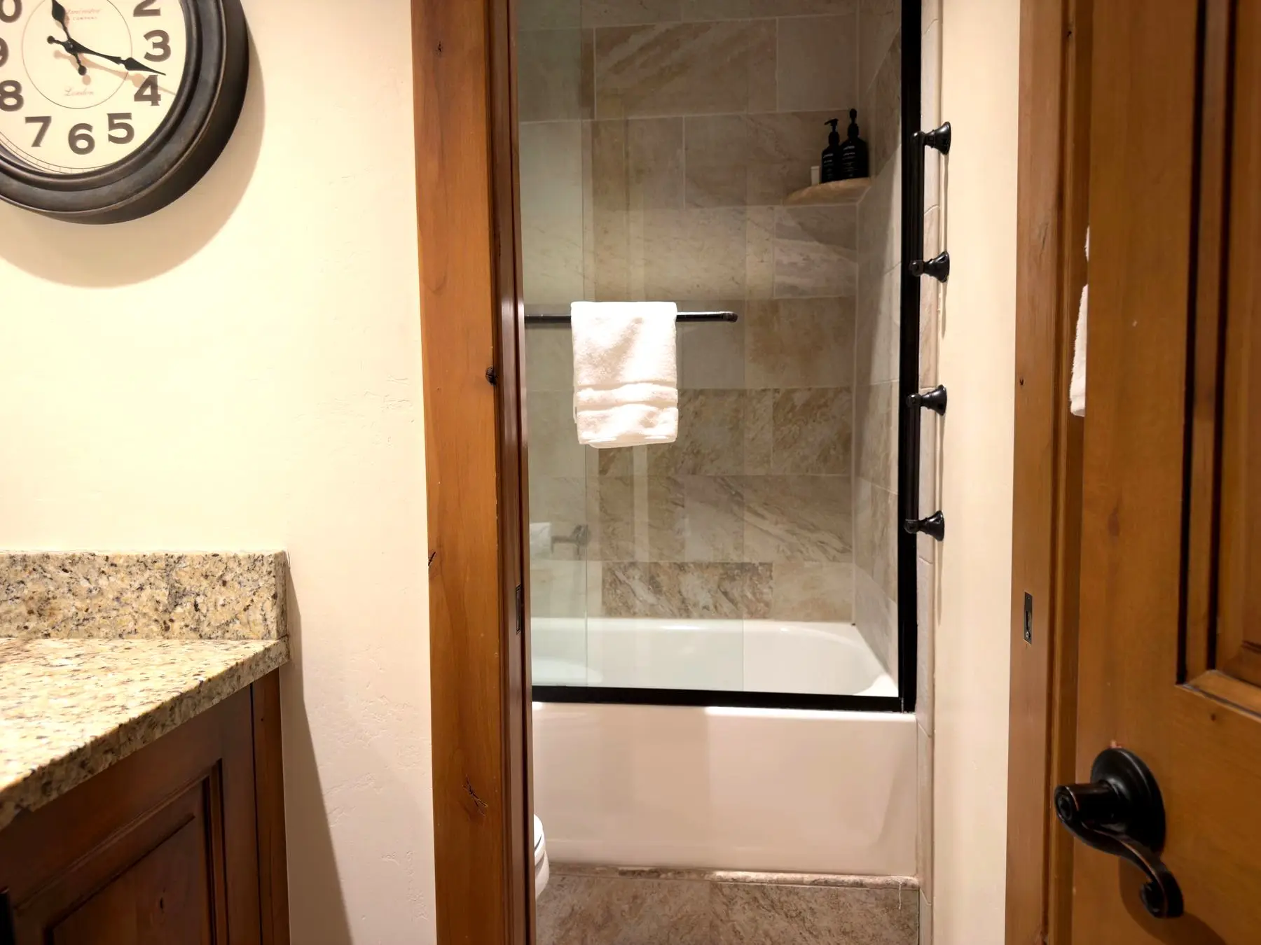 Tiled tub and shower with glass enclosure